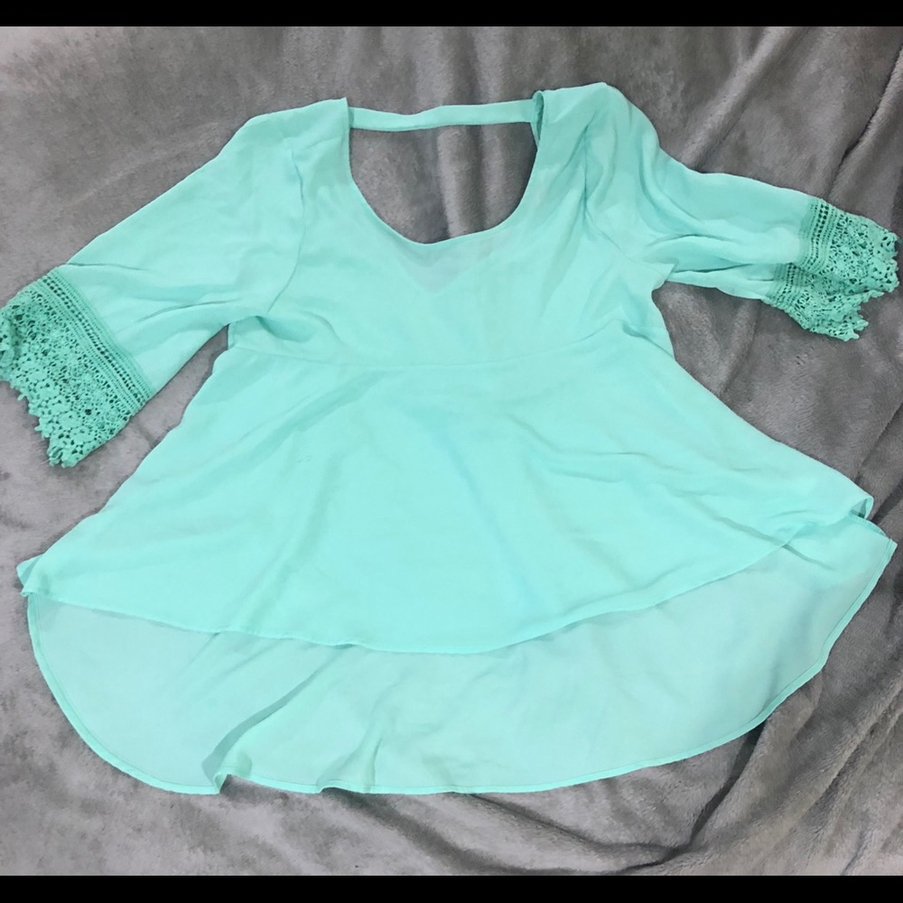 Teal top with lace sleeve and cut one back